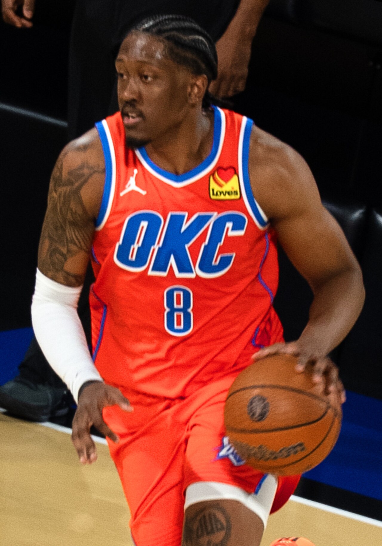 Oklahoma City Thunder player Jalen Williams wearing jersey number 8, dribbling a basketball.