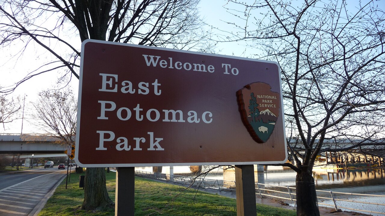A sign that reads 'Welcome To East Potomac Park' with the National Park Service logo.