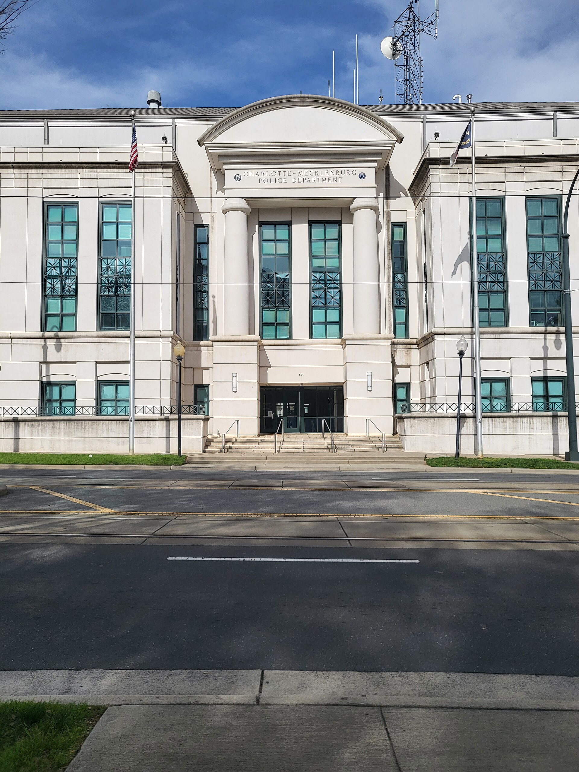 The Charlotte-Mecklenburg Police Department building exterior, a large white building with columns and the department name above the entrance.