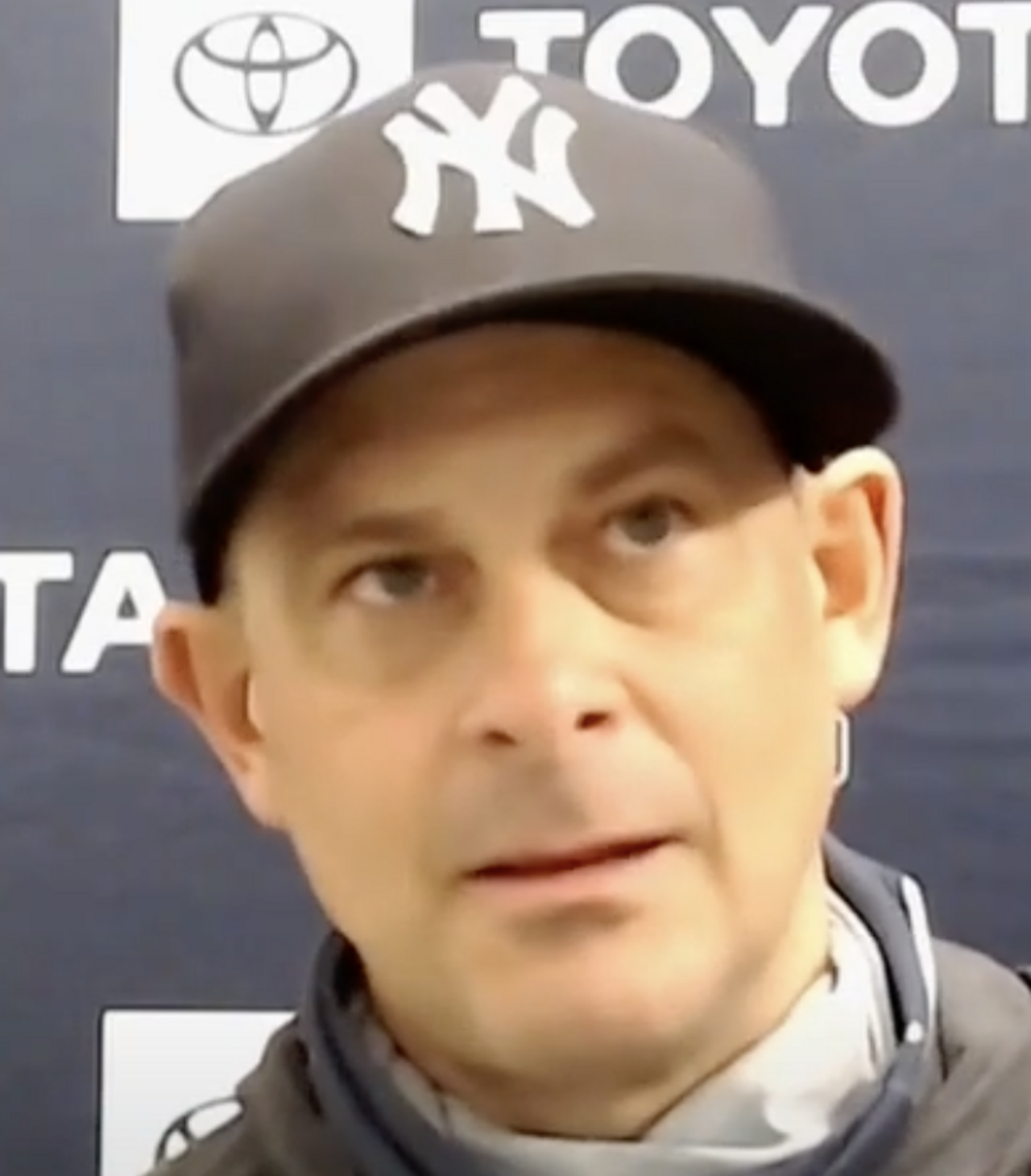 Aaron Boone wearing a New York Yankees cap
