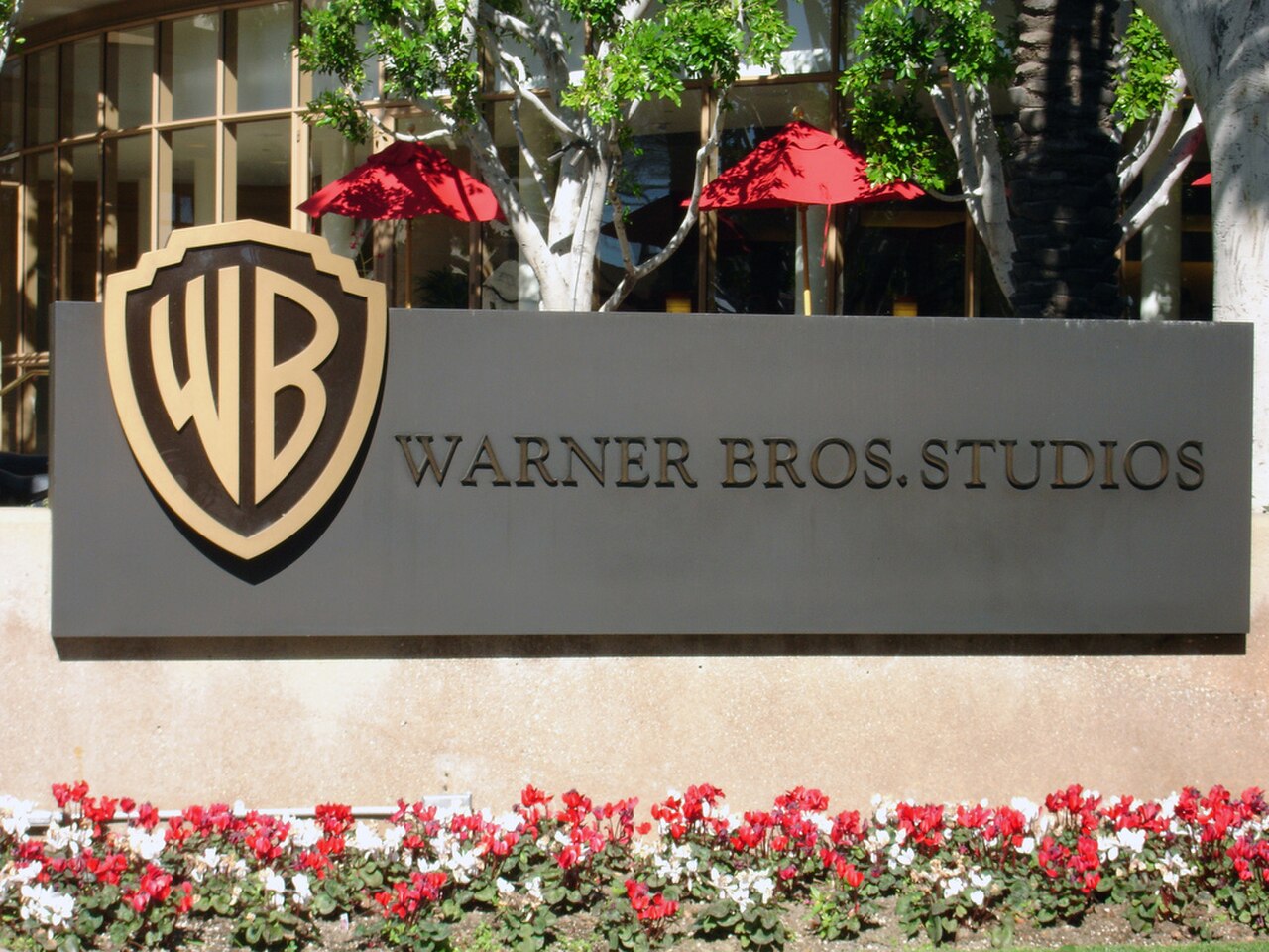 Warner Bros. Studios sign with flowers in front