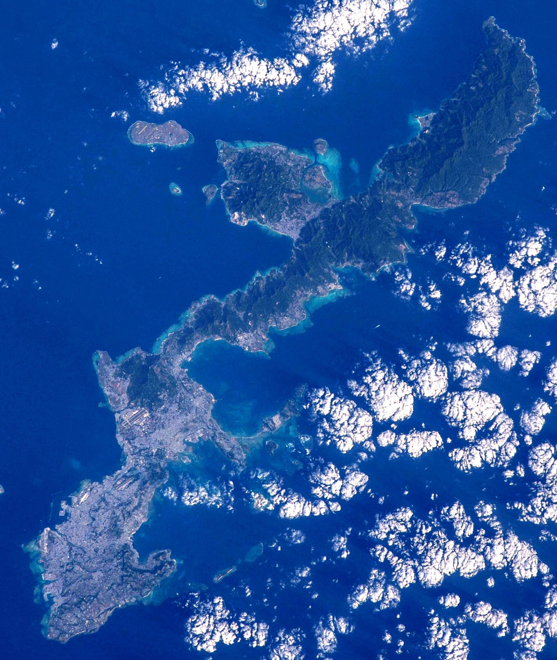 Aerial view of Okinawa, Japan, showing landmasses and surrounding waters