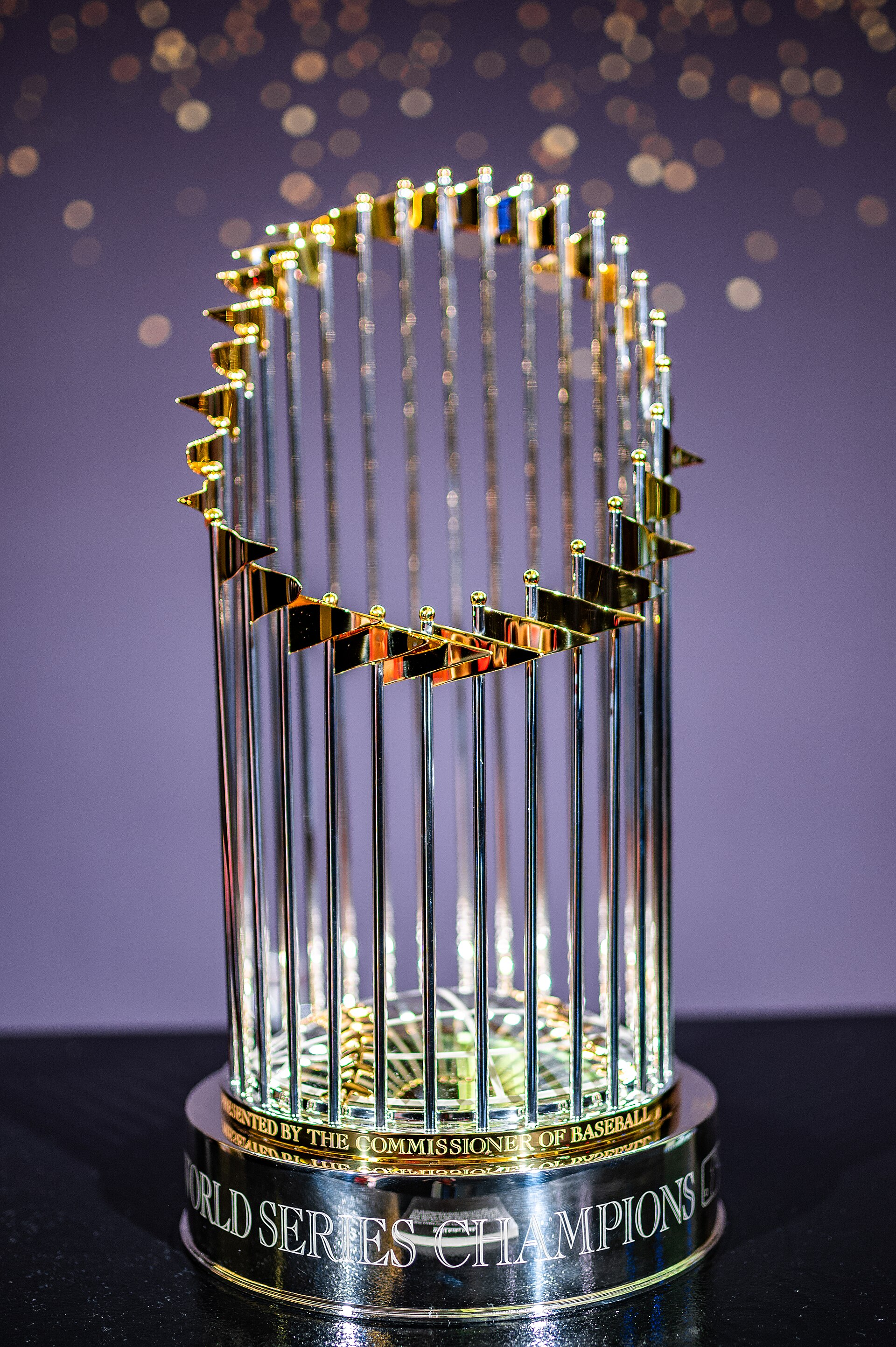 The Commissioner's Trophy, awarded to the World Series champions, is a silver trophy with gold trim and small flags representing each team that has won the championship.