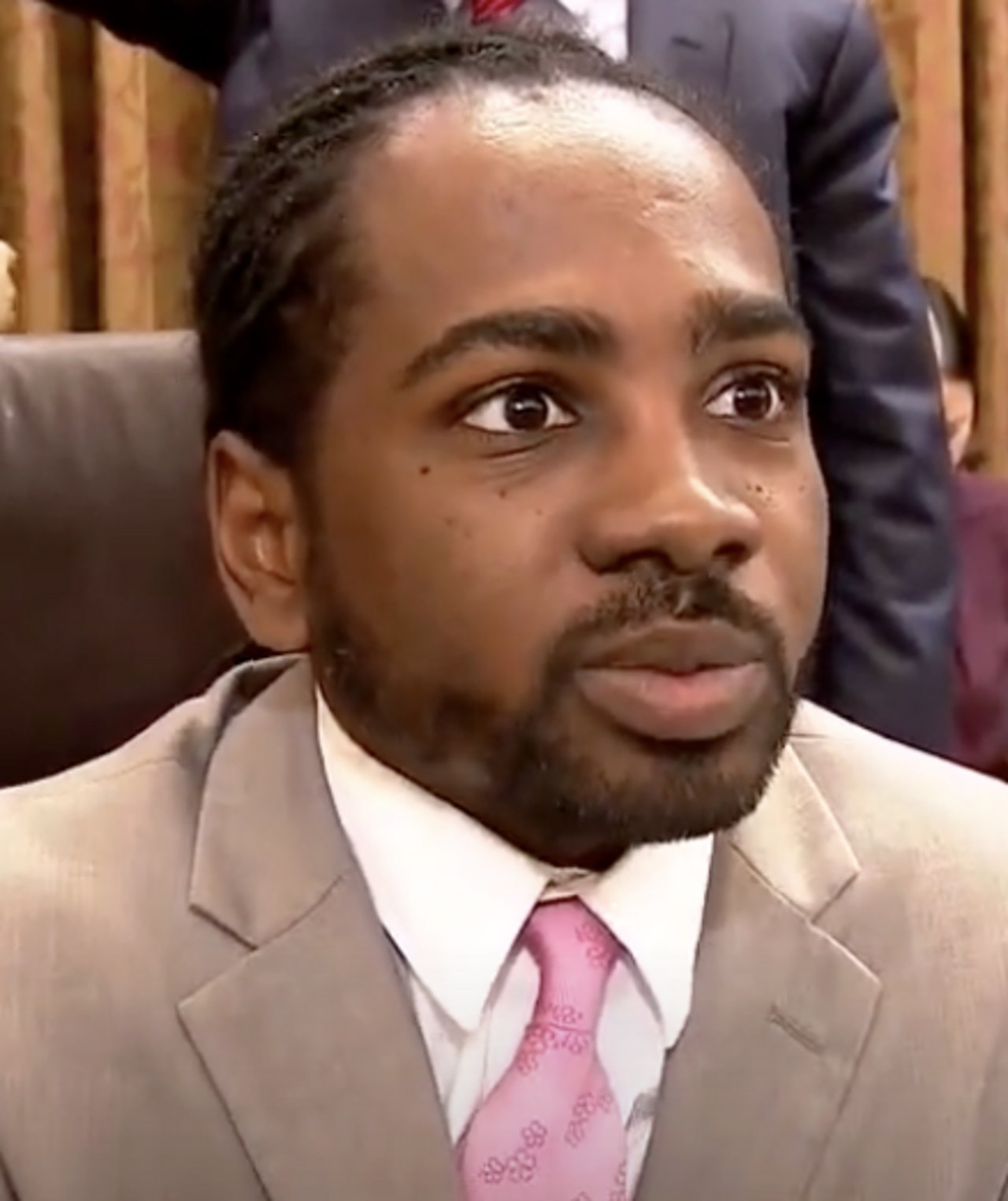D.C. Councilmember Trayon White in a tan suit and pink tie