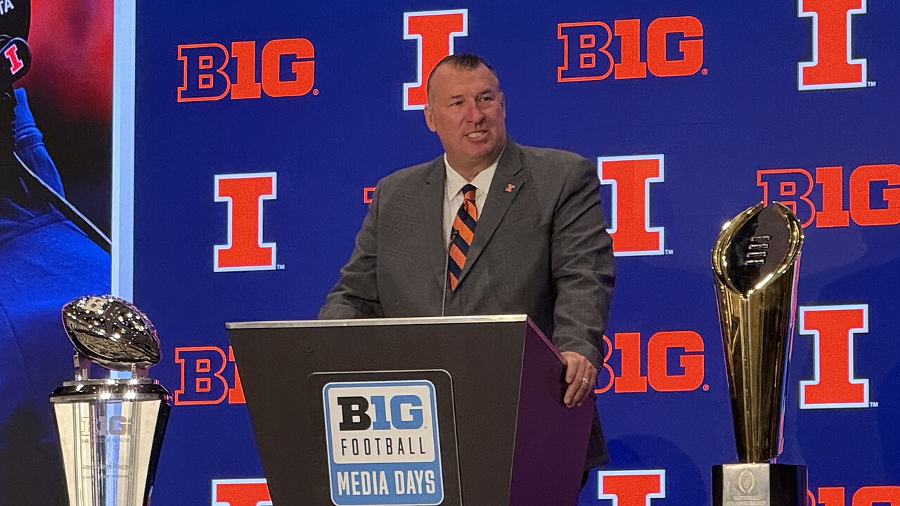 Bret Bielema speaking at a podium at Big Ten football media days