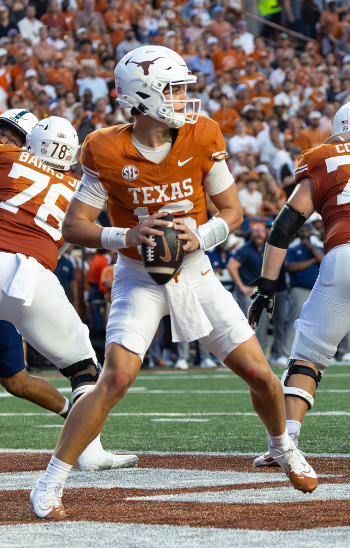 Quarterback Arch Manning of the Texas Longhorns drops back to throw a pass at Darrell K Royal-Texas Memorial Stadium on September 14, 2024.