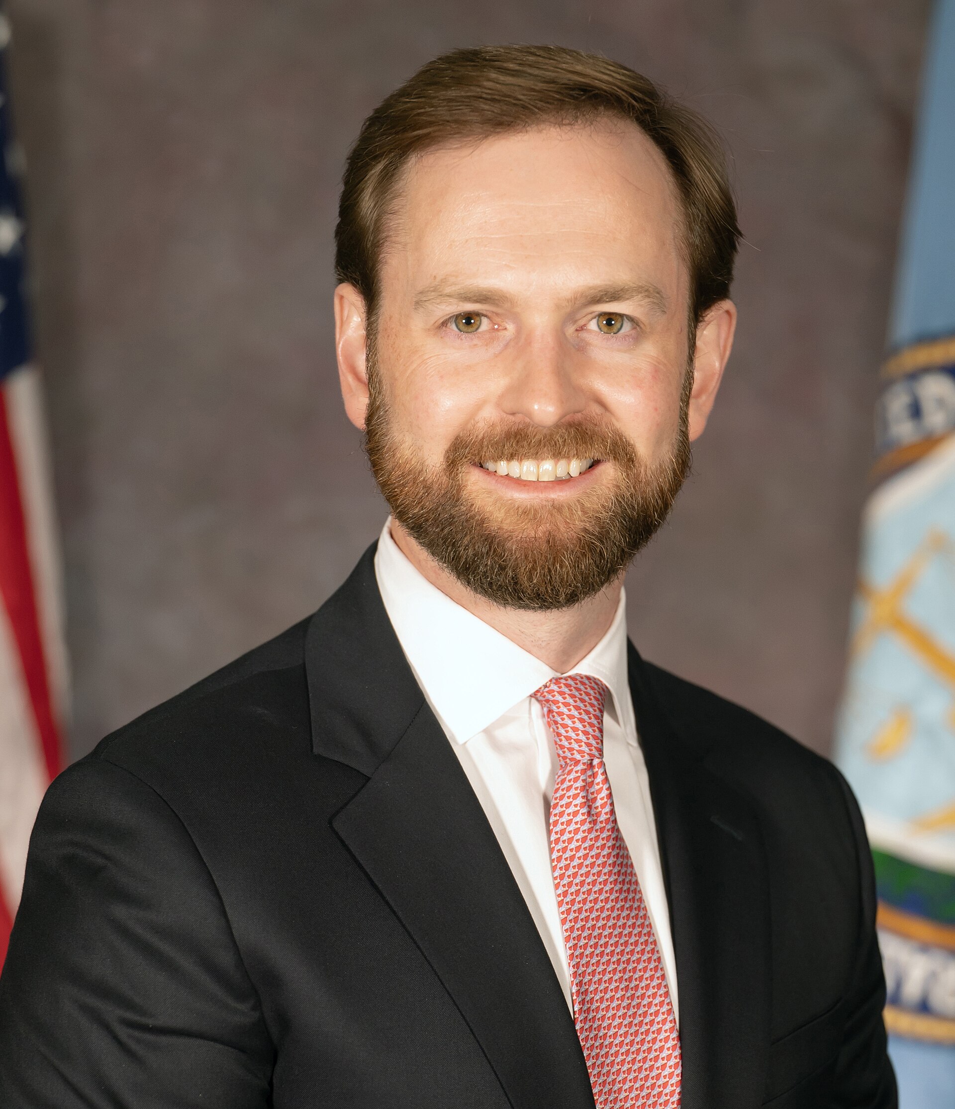 Andrew N. Ferguson, Chairman of the Federal Trade Commission, smiling and wearing a suit and tie.
