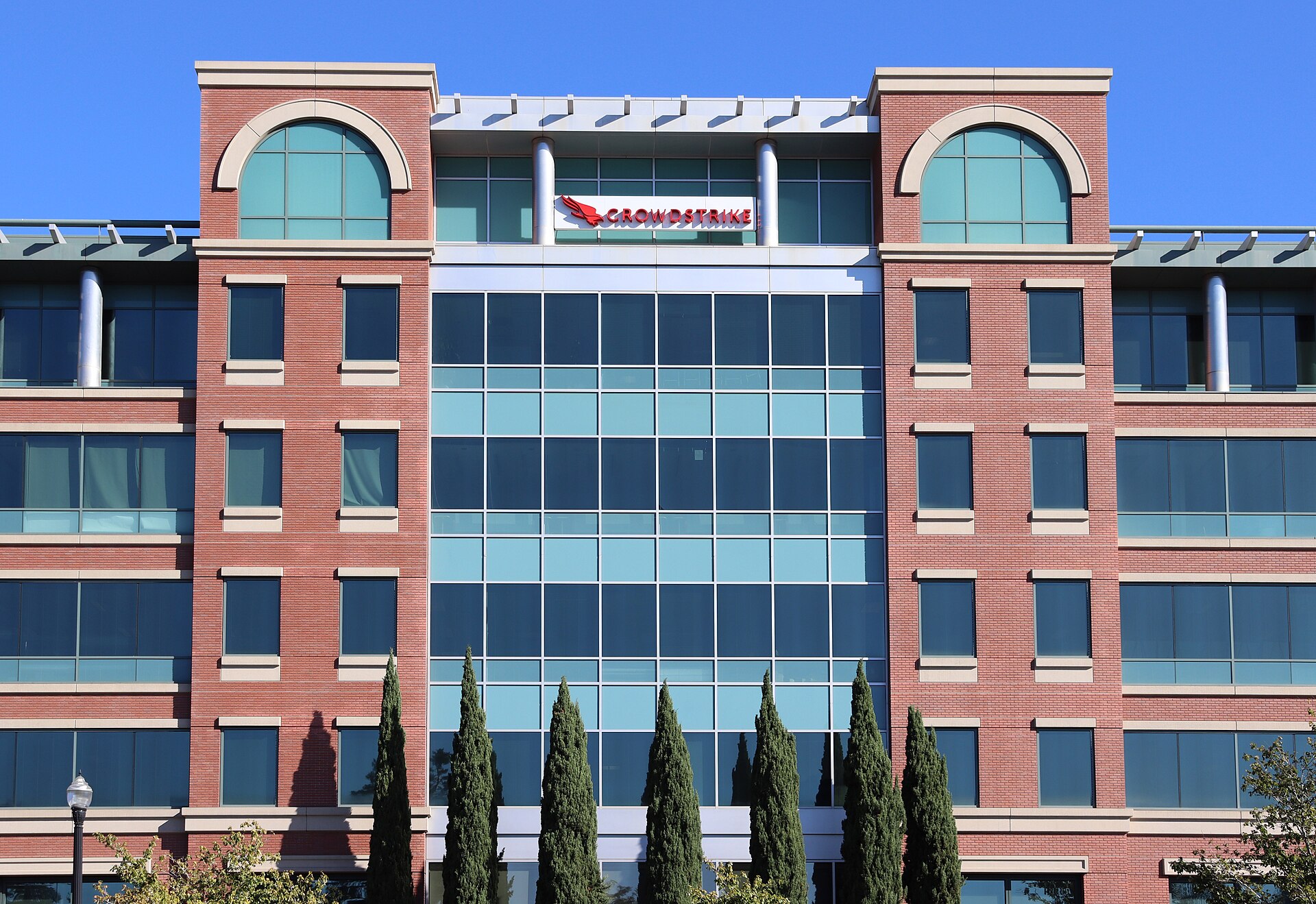 A large brick office building with a sign reading CrowdStrike