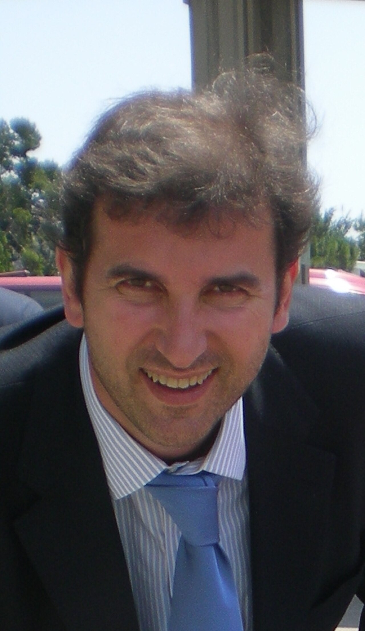 Ferran Soriano smiling and wearing a suit