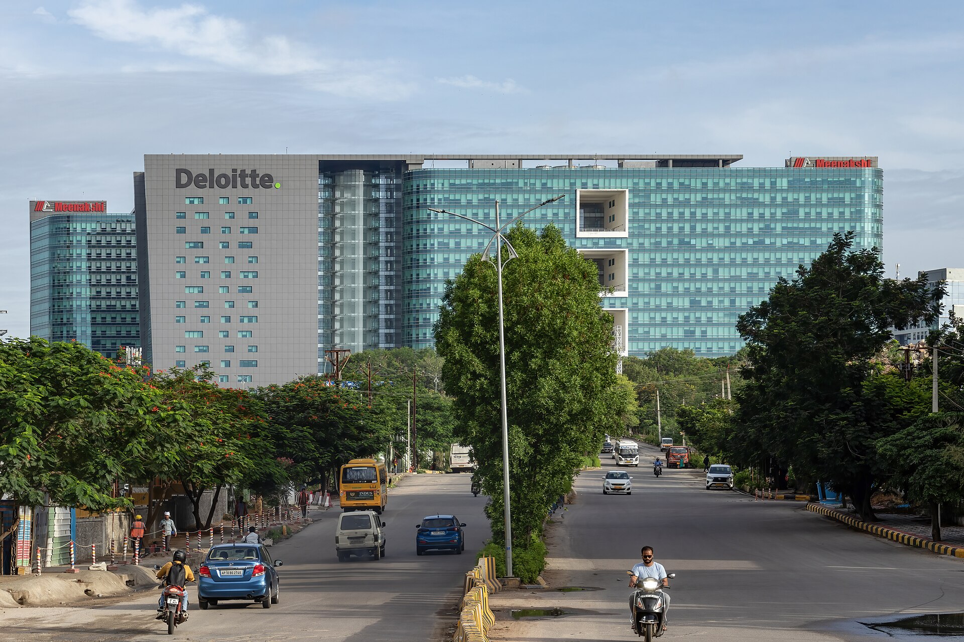 A large office building with Deloitte written on it