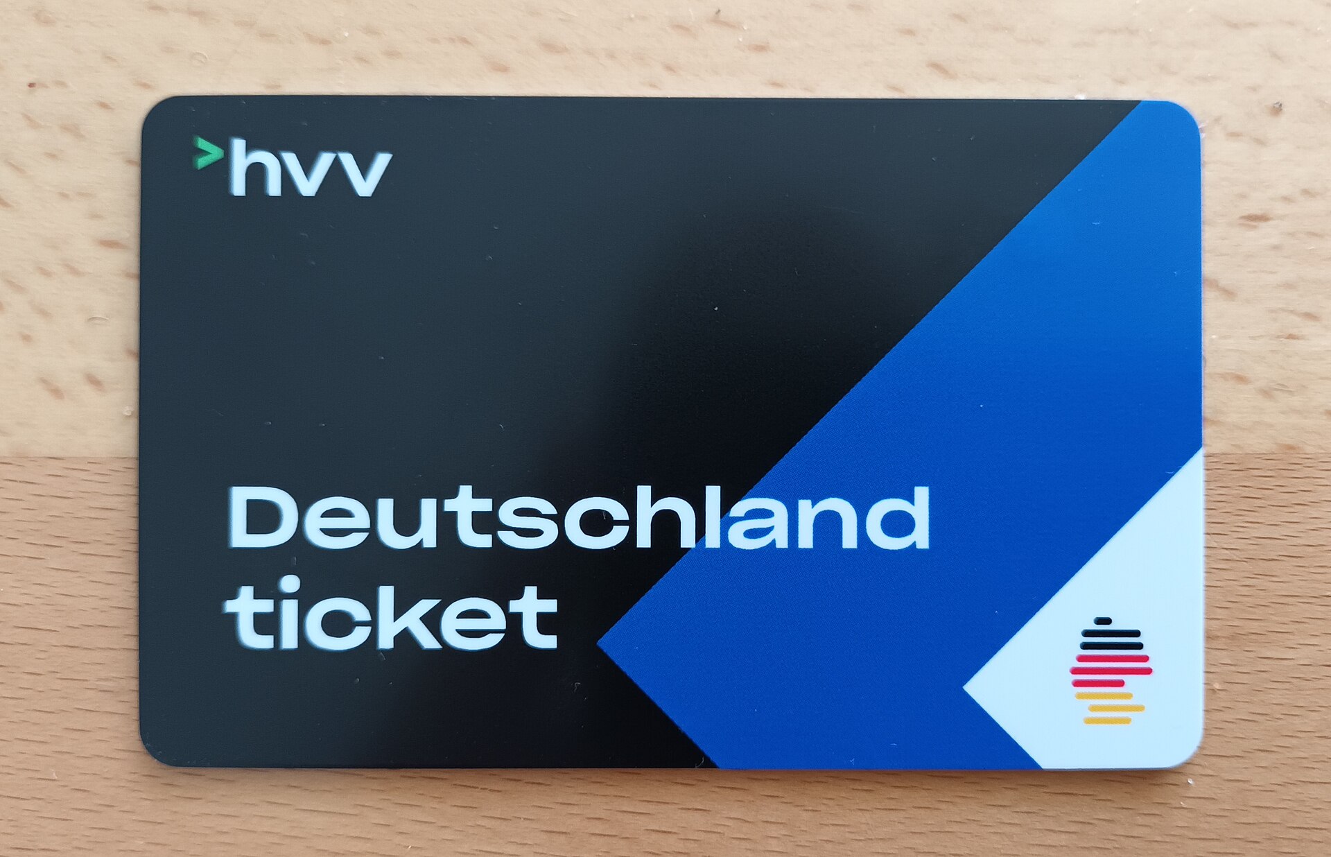 Deutschland ticket on a wooden surface