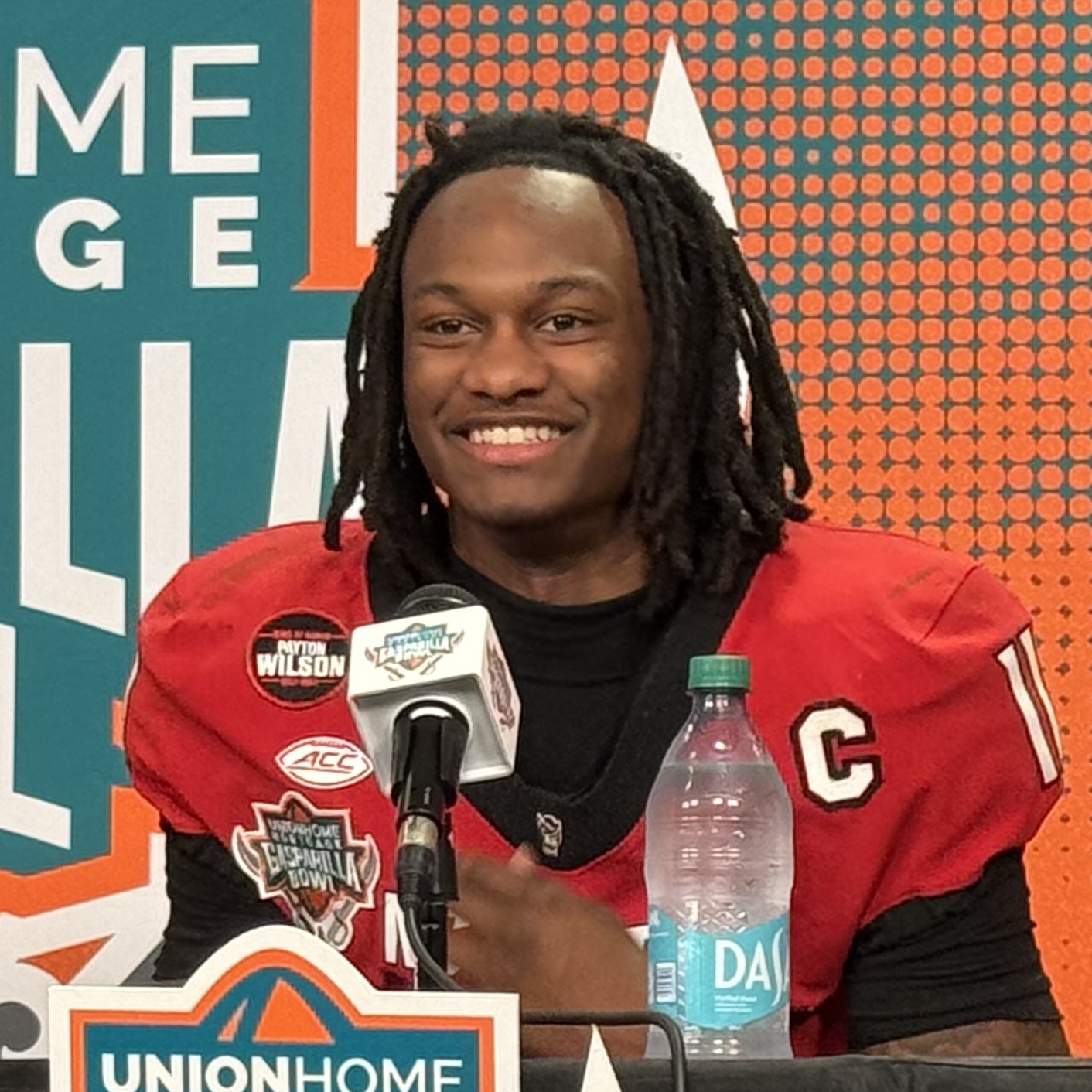CJ Bailey , quarterback of the NC State Wolfpack football team, at a press conference after a 2025 Gasparilla Bowl victory over the Memphis Tigers in Raymond James Stadium , Tampa, Florida .