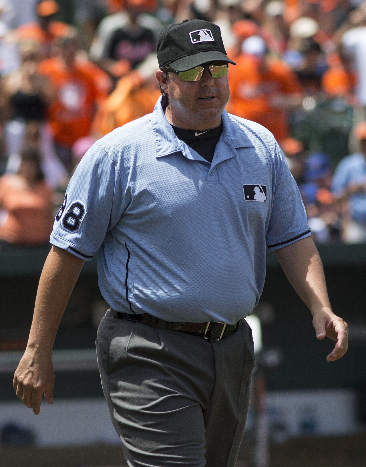 Major League Baseball umpire Doug Eddings standing on the field during a 2013 game.