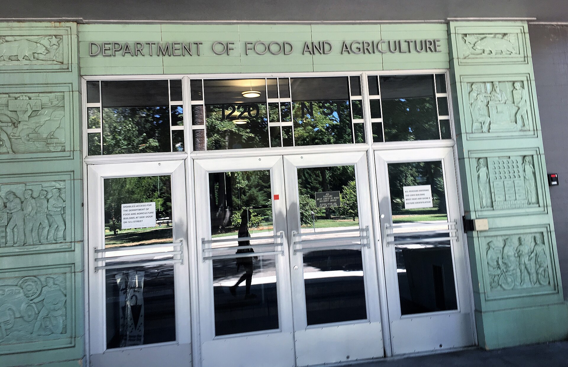 Department of Food and Agriculture building entrance with glass doors and decorative carvings