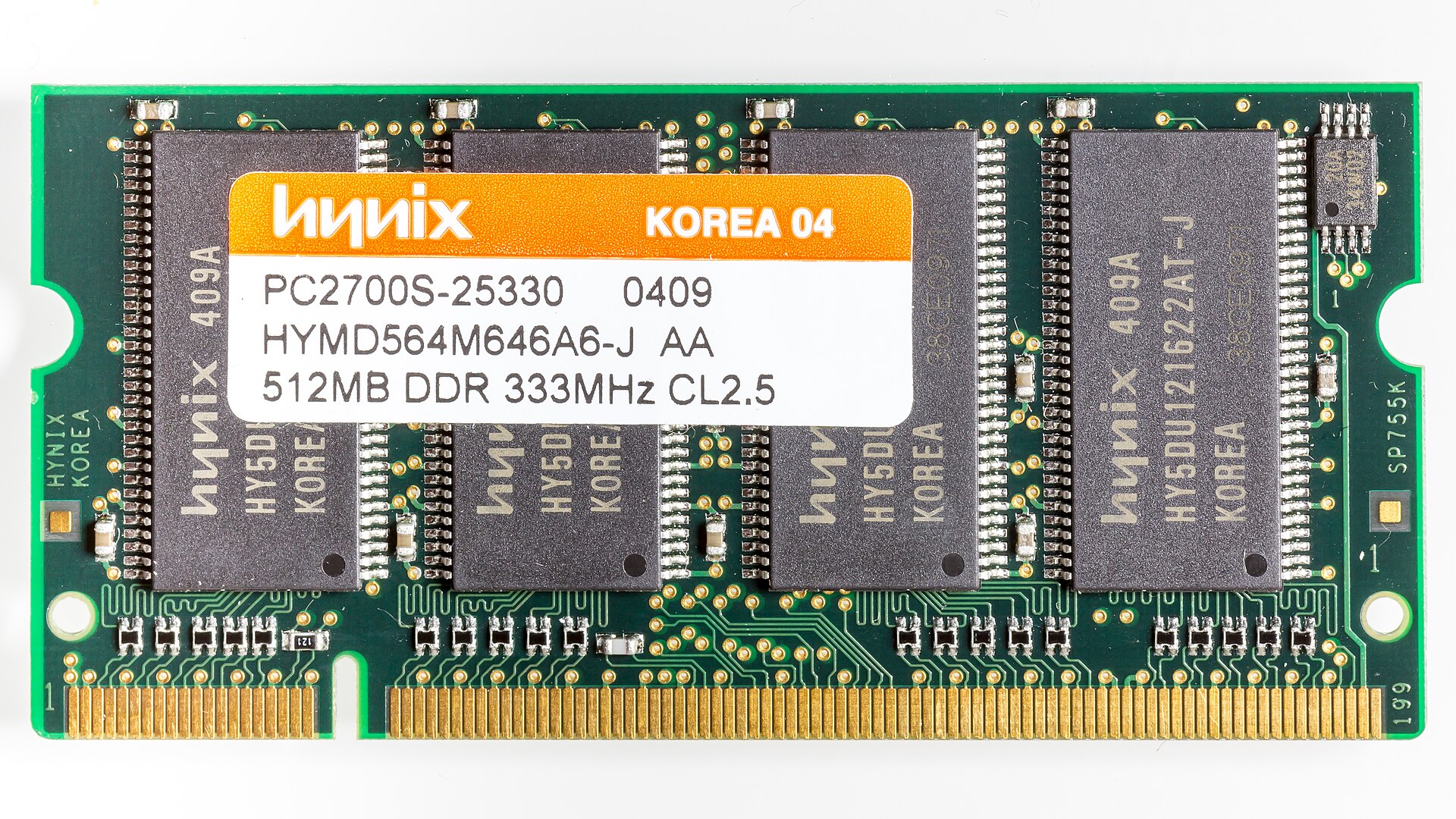 A green computer chip with gold pins and a white and orange label that reads Hynix, Korea, and various product details.