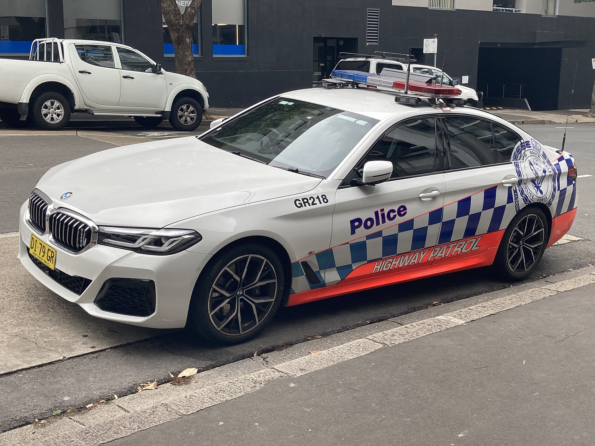A NSW Police Highway Patrol BMW with a Code 3 Pursuit lightbar parked on Riley Street, Darlinghurst