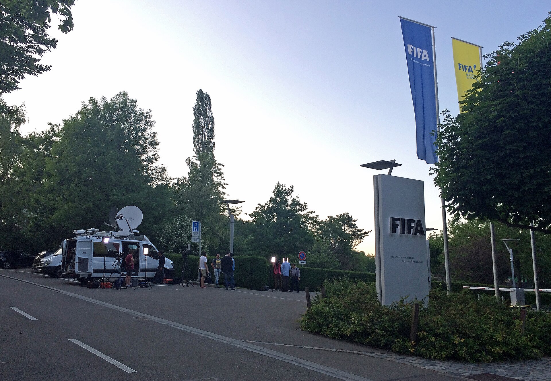 Media in front of FIFA headquarters in Zurich, Switzerland, reporting on the corruption case and Sepp Blatter's resignation