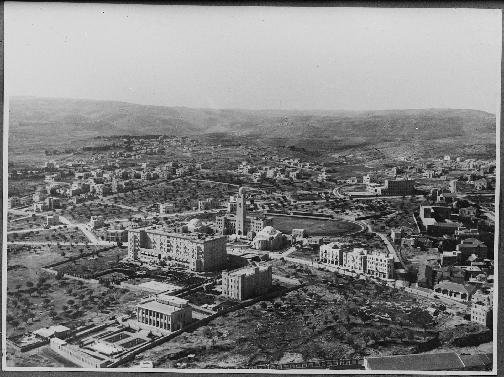 Title: Air views of Palestine. Jerusalem from the air. Newer Jerusalem. Y.M.C.A. and King David Hotel. Looking southwest with French consulate general and the Jesuit seminary Abstract/medium: G. Eric and Edith Matson Photograph Collection Physical description: 1 negative :
