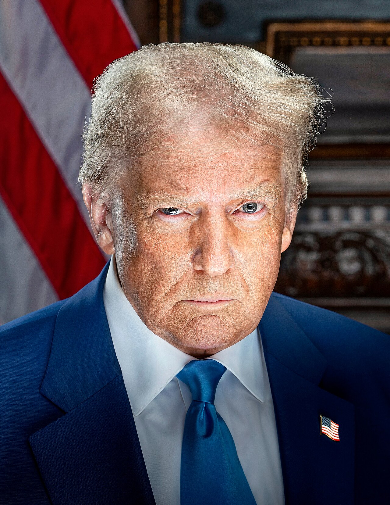 Official presidential portrait of Donald Trump in a dark suit and red tie